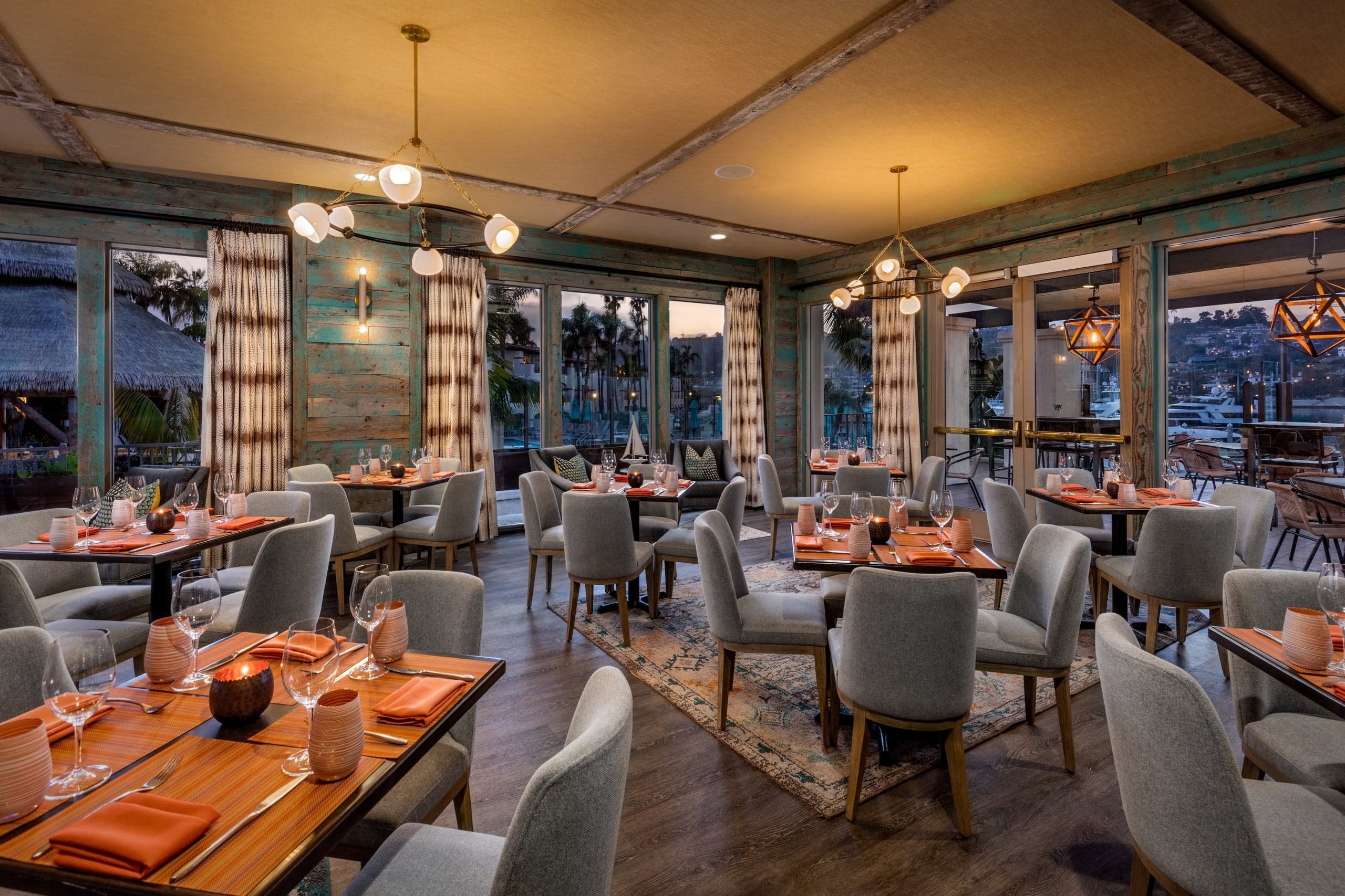 The Vessel private dining room at Kona Kai resort, a large comfortable room surrounded by windows looking out on the San Diego Bay