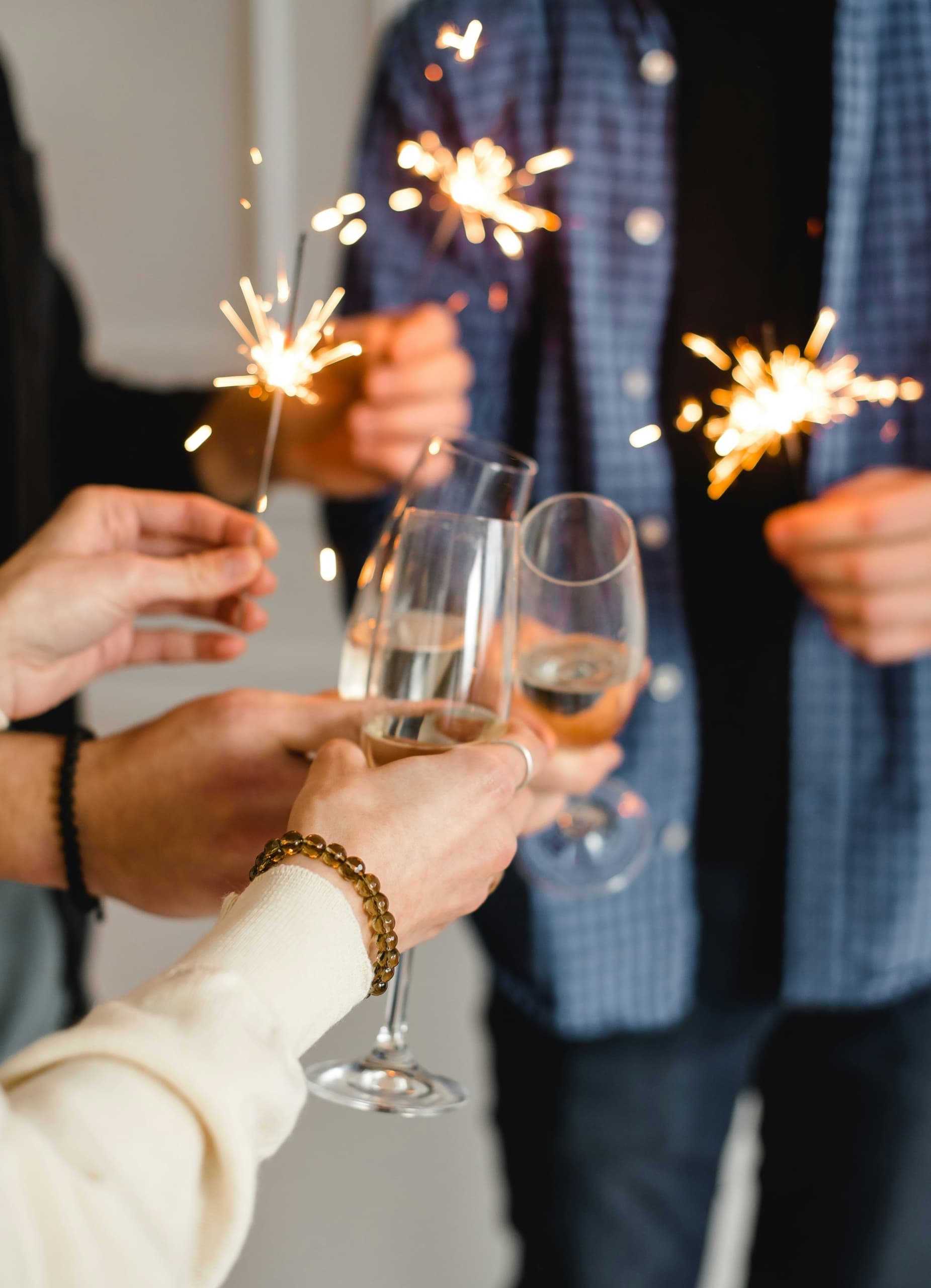 People celebrating with champagne and sparklers at Kona Kai